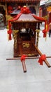 Shenzhen, China: young women burn incense and worship at the beidi temple