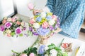 Young women business owner florist making or Arranging Artificial flowers vest in her shop, craft and hand made concept Royalty Free Stock Photo