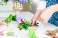 Young women business owner florist making or Arranging Artificial flowers vest in her shop, craft and hand made concept Royalty Free Stock Photo