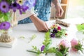 Young women business owner florist making or Arranging Artificial flowers vest in her shop, craft and hand made concept Royalty Free Stock Photo