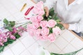 Young women business owner florist making or Arranging Artificial flowers vest in her shop, craft and hand made concept Royalty Free Stock Photo