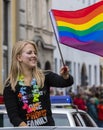 2019: Young women on a car and waving rainbow flags attending the Gay Pride parade also known as Christopher Street Day,Munich