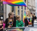 2019: Young women on a car and waving rainbow flags attending the Gay Pride parade also known as Christopher Street Day,Munich