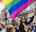 2019: Young women on a car and waving rainbow flags attending the Gay Pride parade also known as Christopher Street Day,Munich