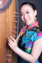 Young women and Chinese zither Royalty Free Stock Photo