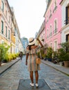 Young women on a citytrip Paris visiting the colorful streets in Paris, Cremieux Street Rue Cremieux