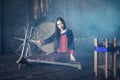 Young women demonstrate to procedure of making Thai Silk weaving Royalty Free Stock Photo