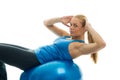 Young women doing crunches on fitness ball Royalty Free Stock Photo