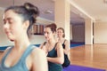 Young women doing meditation in yoga class. Concept of yoga and relaxation Royalty Free Stock Photo