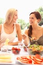 Young women eating outdoors