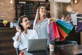 Young women enjoy shopping with credit cards