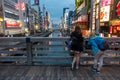 2 young women enjoying themselves on the Dotonbori River at Osaka. It is a very popular tourist spot and shopping and dining