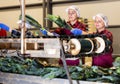 Young women farmers sort leeks