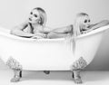 Young woman foreplay lying in tub, intimacy lovers, sexy women. Black white. Royalty Free Stock Photo