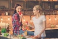 Young women friends cooking meal together at home Royalty Free Stock Photo