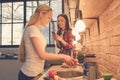 Young women friends cooking meal together at home Royalty Free Stock Photo