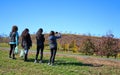 Young women friends enjoying orchard scene