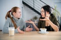 Young women friends offended in cafe while drinking coffee Royalty Free Stock Photo