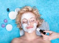 Young women getting facial mask. Royalty Free Stock Photo