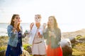 Young women or girls blowing bubbles on beach Royalty Free Stock Photo