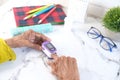 senior women hand using pulse oximeter on table Royalty Free Stock Photo