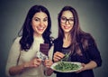 Young women having different diets Royalty Free Stock Photo