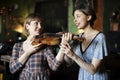 young woman having a violin lesson