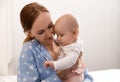 Young woman with her little baby resting after breast feeding Royalty Free Stock Photo