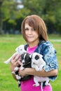 Young Women Holding Three Puppies