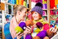 Young women in knitting shop