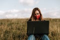 Young women with laptop in the nature, remote job Royalty Free Stock Photo