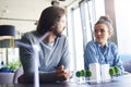 Young woman listening attentively coworkers speech