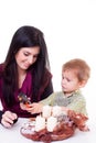 Young women with a little boy made advent wreath Royalty Free Stock Photo