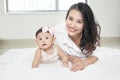 Young woman and little girl having fun in floor Royalty Free Stock Photo