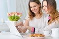 Young women looking at laptop