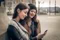Young women looking at a mobile phone Royalty Free Stock Photo