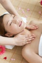 A young women lying in bed enjoying massage Royalty Free Stock Photo