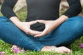 Young women make meditation with green background, yoga and wellness concept