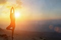 Young women meditate while doing yoga meditation, spiritual mental health practice with silhouette of lotus pose having peaceful Royalty Free Stock Photo