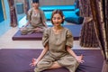 young woman meditating at spa. relaxing body before receiving massage Royalty Free Stock Photo