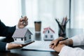 Young woman meeting with a banker for a home loan, Real Estate concept. Approved mortgage application form, concerning mortgage Royalty Free Stock Photo