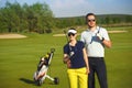 Young women and men playing golf Royalty Free Stock Photo