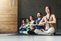 Young women and men in yoga class, relax meditation pose Royalty Free Stock Photo