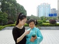 Young women and older women are using mobile phones and WeChat