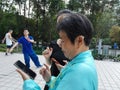 Young women and older women are using mobile phones and WeChat