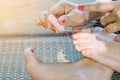 Young women are painted toenails Royalty Free Stock Photo