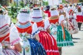 Young women during parade in traditional Czech folklore costumes. Photographed in Southern Moravia, Czechia. Moravian motifs.