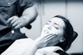 Young woman patient waiting treatment in stomatology clinic.