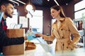 Young woman paying credit card for purchases in grocery store. Royalty Free Stock Photo