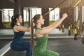 Women performing suspension training in gym Royalty Free Stock Photo